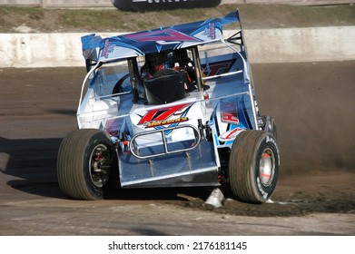 Middletown, NY, USA - April 2, 2022: Short Track Racer Matt Janiak Hustles His Dirt Modified Stock Car Around The Dirt Track At Orange County Fair Speedway. 					