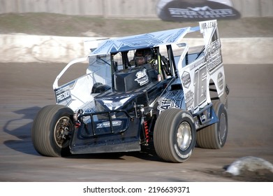 Middletown, NY, USA - April 2, 2022: Short Track Racer Danny Creeden Hustles His Dirt Modified Stock Car Around Orange County Fair Speedway. Car Slightly Blurred To Depict Speed.