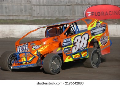 Middletown, NY, USA - April 2, 2022: Short Track Racer Jared Labagh Hustles His Dirt Modified Stock Car Around Orange County Fair Speedway. Car Slightly Blurred To Depict Speed.