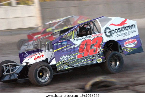 Middletown, NY, USA - June 13, 2020: Short\
track racer Craig Mitchell races his Dirt Modified stock car around\
the dirt track at Orange County Fair Speedway. \
