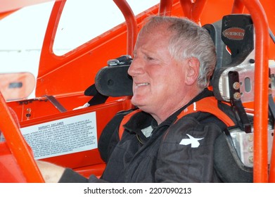 
Middletown, NY, USA - October 22, 2021: Short Track Racer Ken Tremont Sits In His Dirt Modified Stock Car Before A Race At Orange County Fair Speedway In Middletown, NY. 				