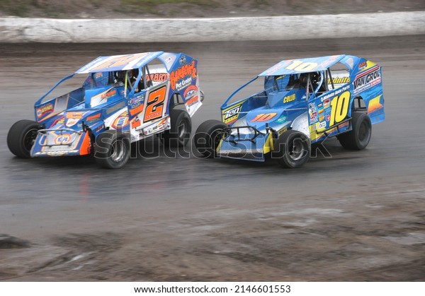 Middletown, NY, USA - October\
24, 2021: Short track racers Rich Eurich (10) and Jack Lehner\
compete at Orange County Fair Speedway in Middletown, NY.          \
          