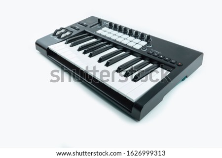 midi controller keyboard, pads nobs and keys.