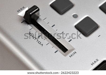 Midi keyboard controller close up with faders wheel buttons and knobs pitch, band, modulation, octave max min