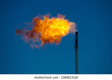 Midland, County / United States - April 21, 2019: Excess Natural Gas Is Burned Off At An Oil Well Site.