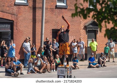 Midland, Ontario  Canada - June 11 2022: A Street Performer, Performs For A Crowd At The Buttertart Festival In Midland, Ontario.