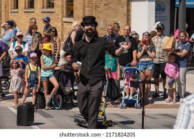 Midland, Ontario  Canada - June 11 2022: A Street Performer, Performs For A Crowd At The Buttertart Festival In Midland, Ontario.