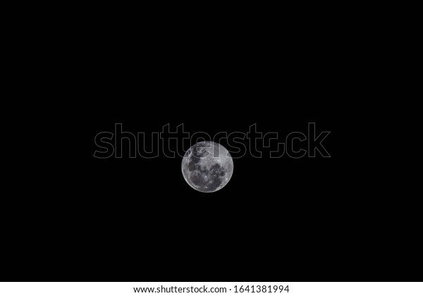 Midnight full moon glow in\
dark sky 