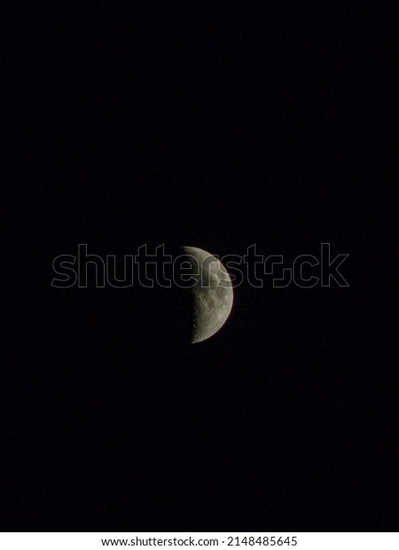 Midnight Half moon photography ,high dynamic\
resolution pic of moon closeup. Midnight moon with clear sky,\
lovely and beautiful.