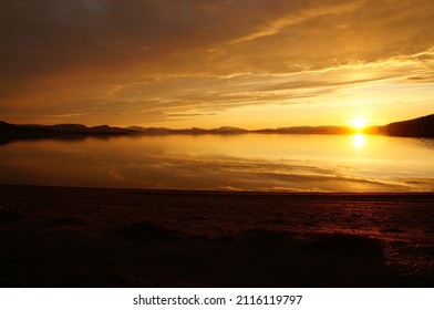 Midnight sun and lake in Lapland.