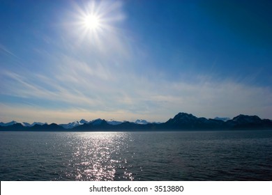 Midnight Sun Over The Mountains In Alaska