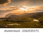 Midnight sun rising over Knivskjellodden, a trail in the tundra towards the true northernmost point of Europe, Norway