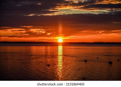 Midnight sun at summer solstice in Oulu, Finland looking at the beach of Bothnian Gulf - Shutterstock ID 2131869405