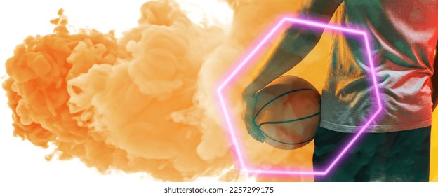 Midsection of biracial basketball player holding ball with hexagon over smoky background. Composite, copy space, rear view, hand, illuminated, sport, competition, illustration, shape and abstract. - Powered by Shutterstock