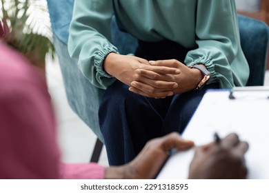 Midsection of biracial female patient attending therapy with african american male therapist. Mental health, therapy and counselling. - Powered by Shutterstock