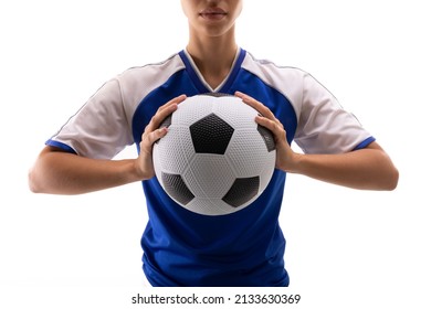 Midsection of biracial young female soccer player holding soccer ball against white background. unaltered, sport, sports uniform, athlete and women's soccer. - Powered by Shutterstock