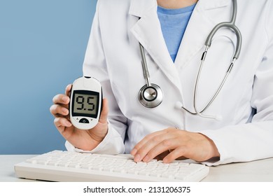 Mid-section Of A Female Doctor Showing Blood Suger Level Tester