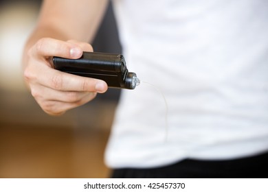 Midsection Of Man Holding Glucose Monitor In Gym