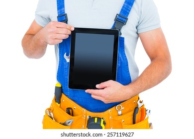 Midsection Of Repairman Holding Digital Tablet On White Background