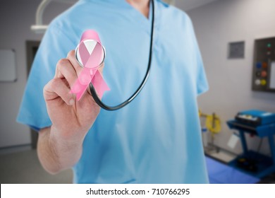 Midsection of surgeon holding stethoscope against equipment and medical devices in modern operating room