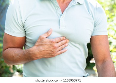 Midsection View Of A Man Having Acid Reflux Pain