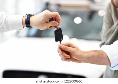 Midsection of young couple buying new car
