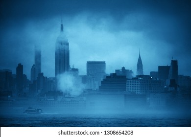 Midtown Manhattan skyscrapers and boat in fog in New York City - Powered by Shutterstock