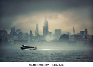 Midtown Manhattan Skyscrapers And Boat In Fog In New York City