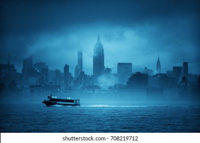 Midtown Manhattan Skyscrapers And Boat In Fog In New York City