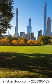 Midtown Manhattan View Of Central Park In Fall With Billionaires Row Skyscrapers From Sheep Meadow. New York City