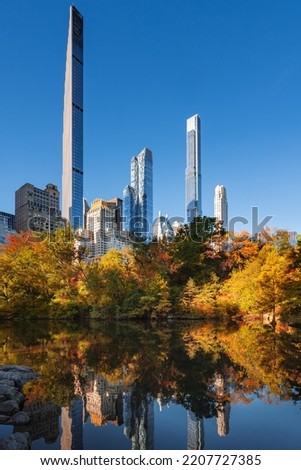 Midtown Manhattan view of Central Park in Fall with Billionaires Row skyscrapers. New York City 