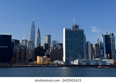 Midtown Manhattan, view from Queens across the East River.   Chrysler building, United Nations building.