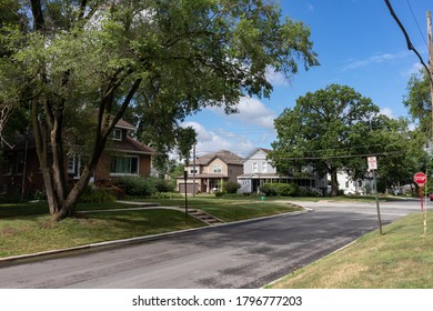 Midwest Neighborhood Street With Old Homes And Green Trees During The Summer In Lemont Illinois