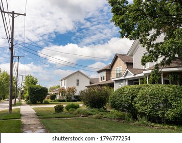 Midwest Neighborhood Street And Sidewalk With Old Homes And Green Trees During The Summer In Lemont Illinois