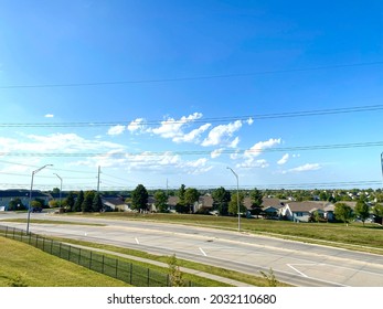 Midwest Suburb Street View Photograph With Clouds And Residential Area