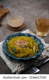 Mie Glosor, Bogor Traditional Cuisine.  Mie Aci Kuning From Tapioca, Which Is Stir-fried With Green Onions And Other Spices.  Served With Peanut Sauce And Fried Chili Sauce.  Many Are Available During