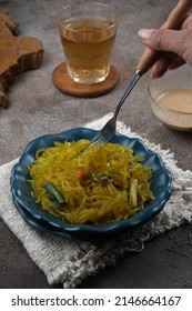 Mie Glosor, Bogor Traditional Cuisine.  Mie Aci Kuning From Tapioca, Which Is Stir-fried With Green Onions And Other Spices.  Served With Peanut Sauce And Fried Chili Sauce.  Many Are Available During