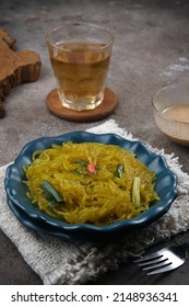 Mie Glosor, Bogor Traditional Cuisine.  Mie Aci Kuning From Tapioca, Which Is Stir-fried With Green Onions And Other Spices.  Served With Peanut Sauce And Fried Chili Sauce.  Many Are Available During