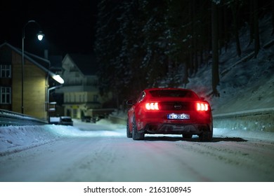 Miedzygorze, Poland - February 14, 2021: Ford Mustang GT Rear Wheel Drive Powerful Car On Winter Road