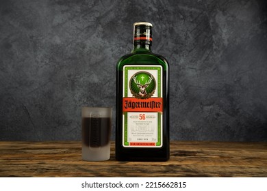 MIEKINIA, POLAND - AUGUST 9, 2022: Jägermeister Bottle And Shot Glass. German Digestive Alcohol Drink (digestif). Jagermeister Liqueur Made With 56 Herbs And Spices.