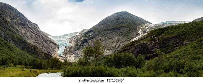 The mighty Briksdal Glacier is part of the Jostedal Glacier national park. From a height of 1200 metres the wild glacier drops right down into the narrow, fertile Briksdalen