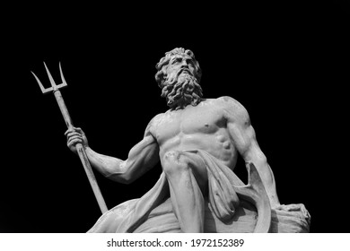 The mighty god of the sea and oceans Neptune (Poseidon) The ancient statue isolated on black background. - Shutterstock ID 1972152389