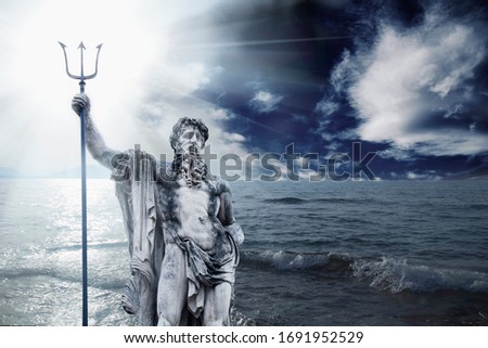 The mighty god of the sea and oceans Neptune (Poseidon). The ancient stone statue against dramatic sea landscape.