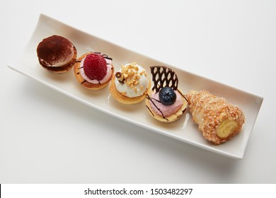 mignon pastry Italian style sweets desserts pastries plate of pastries