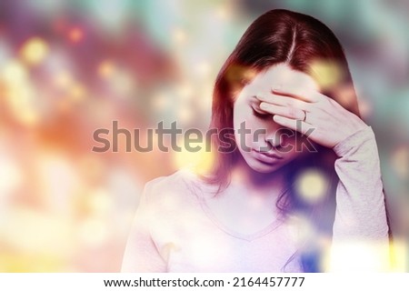 Migraine aura, Portrait of a young woman suffering from headache, epilepsy or other problem