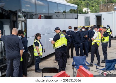 Migrants Are Loaded Onto A Bus In Dover, Kent, UK. 02.08.21