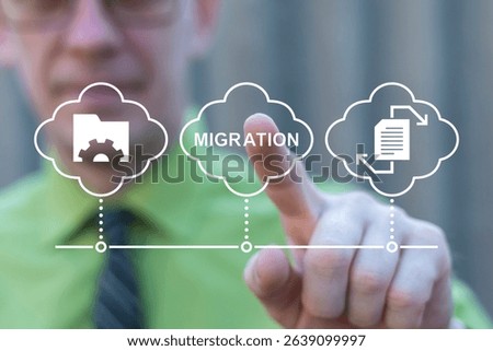 Migration Data Web Technology Concept. Business person using virtual touch screen push word: MIGRATION. Digital data transfer and exchange documents.