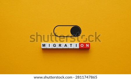 Migration word below toggle switch for immigration policy debate.