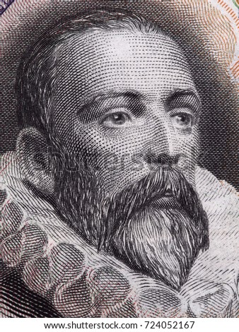 Miguel de Cervantes face portrait on Spain 100 pesetas banknote (1928) closeup macro, great Spanish writer.