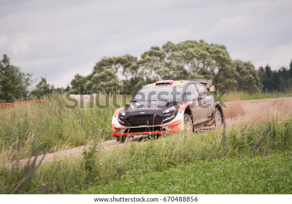 Mikolajki, Poland - 1 July 2017: Mads Ostberg and\
his codriver Ola Floene M-Sport World Rally Team in a Ford Fiesta\
WRC race in the 74nd Rally Poland, on July 1, 2017 in Mikolajki,\
Poland.